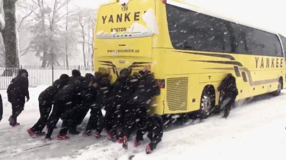 Northeastern University Woman’s Basketball Team Pushes Bus Out of Snow